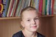 Beautiful girl on books background