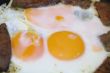 Fried eggs and meat for breakfast