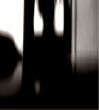 Silhouette behind the glass door