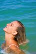 The sexual young girl swims in the sea