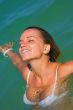 The sexual young girl swims in the sea