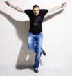 man in blue jeans and a black T-shirt