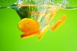 YELLOW CITRUS SPLASHING IN WATER 