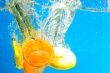 Citrus slice SPLASHING IN WATER 