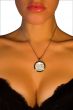 Women`s chest with a medallion