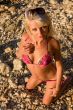 The sexual young blonde girl on a beach