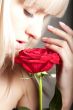 Woman smelling a rose