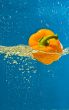 YELLOW PEPPER SPLASHING IN WATER 