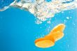 Citrus slice SPLASHING IN WATER 