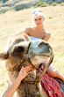 A girl riding a camel