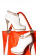 A pair of women`s ankle boots and handbag