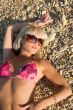 The sexual young blonde girl on a beach