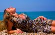 beautiful woman on stone beach