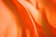 Beautiful background, flying orange fabric