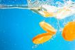 Citrus slice SPLASHING IN WATER 