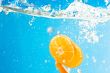 Citrus slice SPLASHING IN WATER 