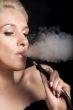 Woman smokes a hookah