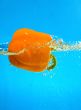 YELLOW PEPPER SPLASHING IN WATER 
