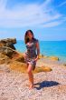 beautiful woman on stone beach