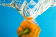 YELLOW PEPPER SPLASHING IN WATER 