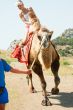 A girl riding a camel