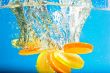Citrus slice SPLASHING IN WATER 