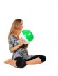 Pregnant girl in an inflatable ball color