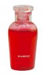 Small red bottle of shampoo