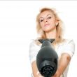 Blonde girl with hair dryer