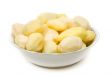 Peeled potatoes on plate