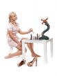 Beautiful blonde girl playing chess with a decorative dragon