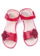 pair of a little girl`s red shoes