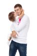 Studio portrait of loving young father hugging his child