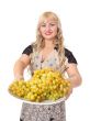 Portrait of attractive young woman holding bowl of grapes