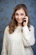 Woman talking on the phone on the background of the retro patter