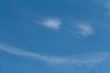 White cloud in the sky with the shape of a smile