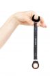new wrench in female hand. 