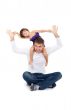 Cheerful daughter on the neck with his father in the studio