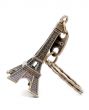 Small bronze copy of Eiffel tower figurine isolated on white bac