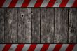wooden background with warning bars