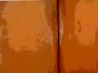Peeling paint on rusted metal surface