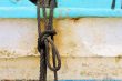Peeling paint on rusted metal surface