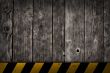 wooden background with warning bar