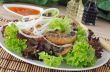 Rice noodles with mushrooms in breadcrumbs in lettuce leaves