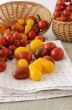 Scattered different varieties of tomatoes on a napkin