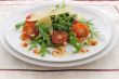 salad of arugula and cherry tomatoes with parmesan sauce