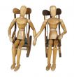 Couple in Rocking Chairs Holding Hands