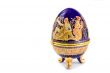 Casket in the form of an Easter egg with an ornament.