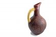 Ceramic jug for wine from red clay on a white background