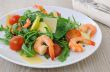 Spicy salad of arugula with cherry tomatoes and shrimp